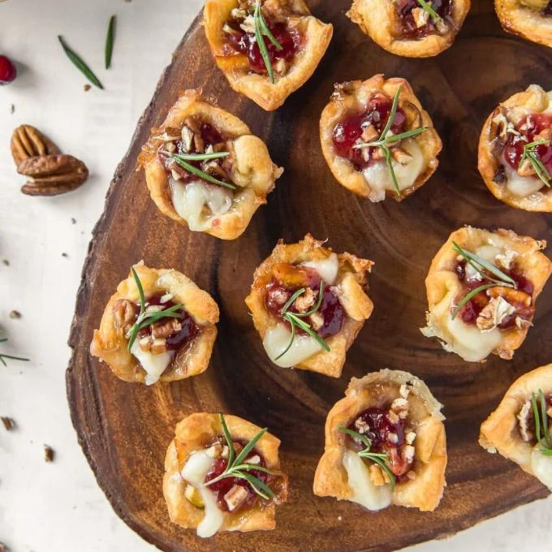 These Baked Raspberry Brie Puffs are a must-have appetizer! The raspberry dark balsamic complements the brie and adds a delicious richness to the puffs.