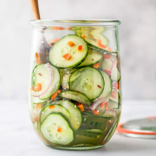 This cucumber salad recipe is tossed together in a sweet and tangy dressing and it’s an easy and refreshing salad that takes just minutes to put together!