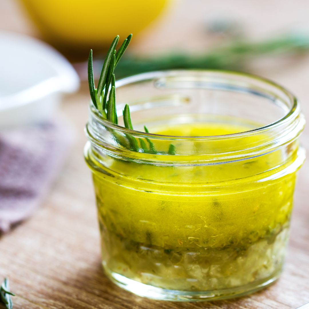 Lemon Herb Vinaigrette is an easy-to-make and deliciously tangy addition to salad greens. Toss all the ingredients in a canning jar, shake vigorously, and enjoy!