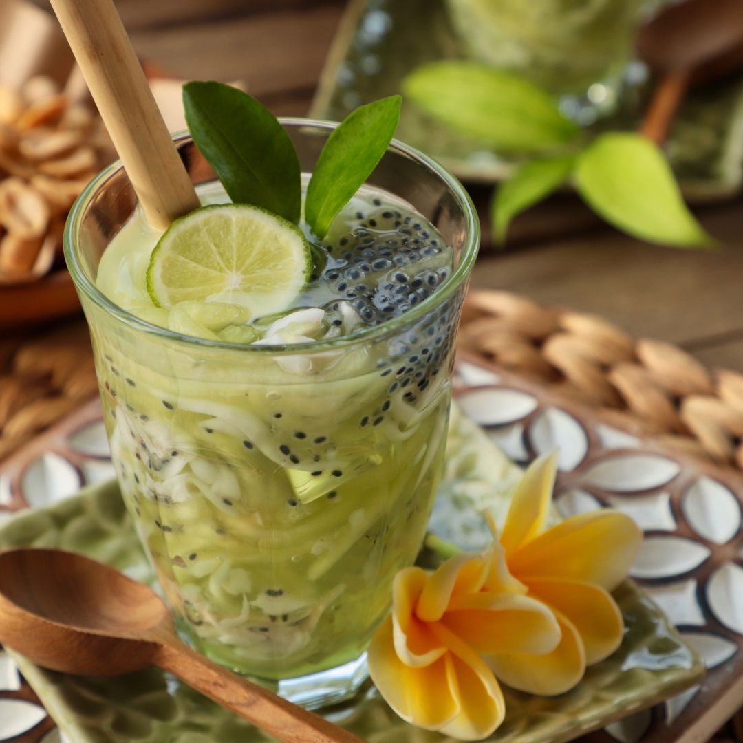 Coconut Es Kuwut is a Balinese drink made from coconut water mixed with melon, lime, and chia seeds. The perfect drink for a hot and sunny day.