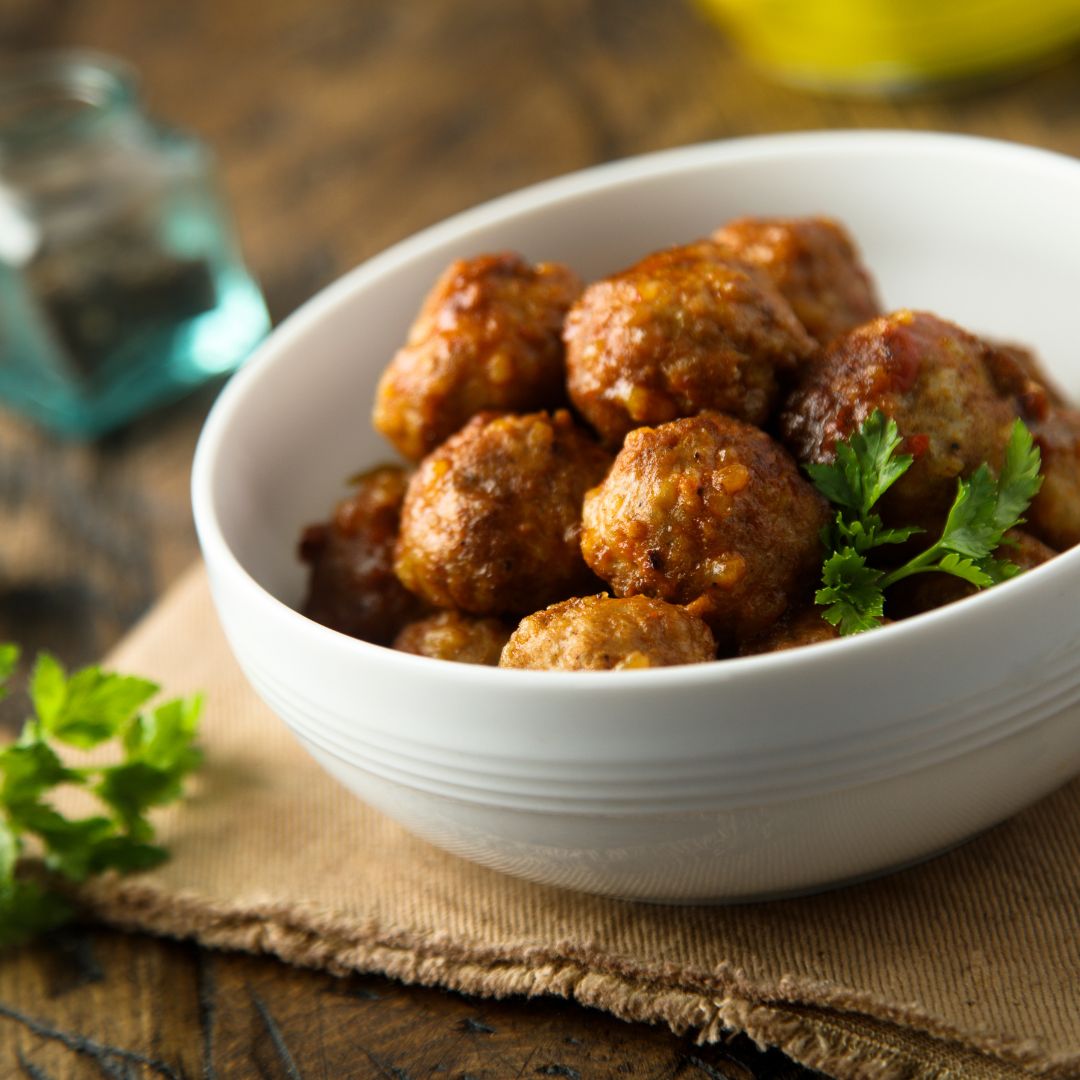 This recipe for chicken meatballs is a fantastic appetizer or great over a big plate of pasta! They are baked until golden brown, moist, and filled with flavor!