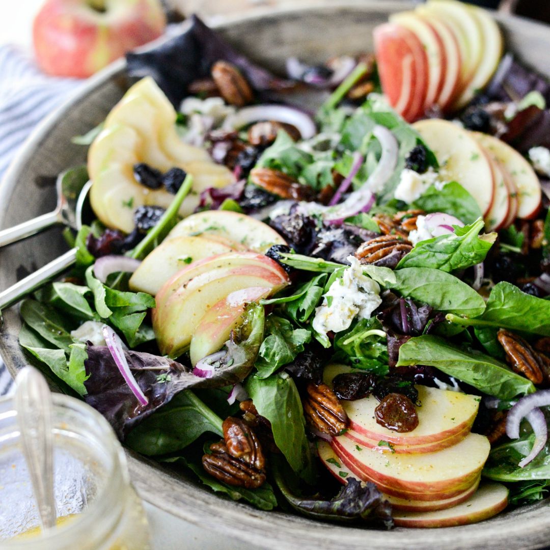 This Sweet Mixed Winter Salad recipe is a mix of spring greens, baby spinach topped with sliced apples, red onion, dried cherries, pecans or walnuts and gorgonzola or blue cheese. It’s not only a party for your taste buds, but visually stunning as well!