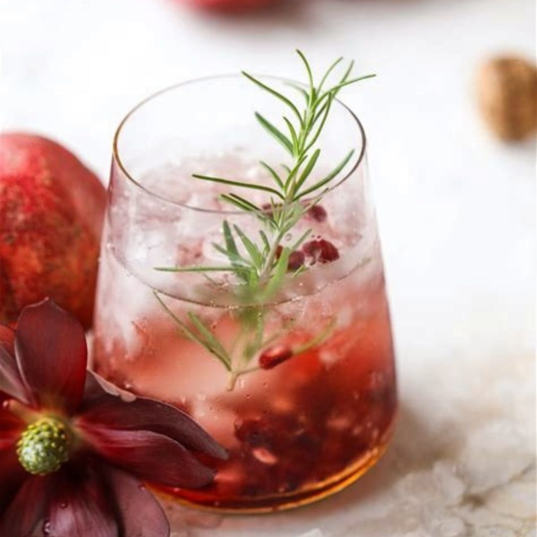 This pomegranate-quince smash cocktail recipe is refreshingly tart, sweet, and delicious! This beautiful ruby-colored cocktail is always a favorite during the holidays!