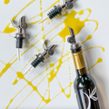 Self-Closing Slow Pour Tops at The Little Shop of Olive Oils.  Premium Extra Virgin Olive Oil, Aged Balsamic Vinegar, Gourmet Essentials.