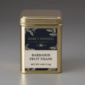 Gold tea canister labeled 'Barbados Fruit Tisane' by Mark T. Wendell on a gray background