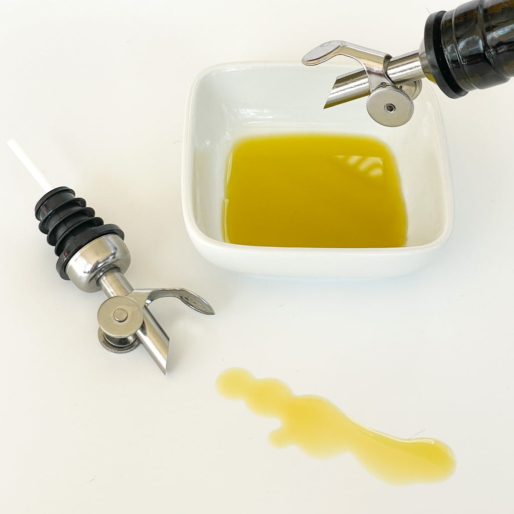 Self-Closing Slow Pour Tops at The Little Shop of Olive Oils.  Premium Extra Virgin Olive Oil, Aged Balsamic Vinegar, Gourmet Essentials.